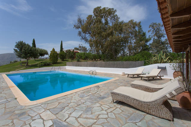 swimming pool and sun loungers greece