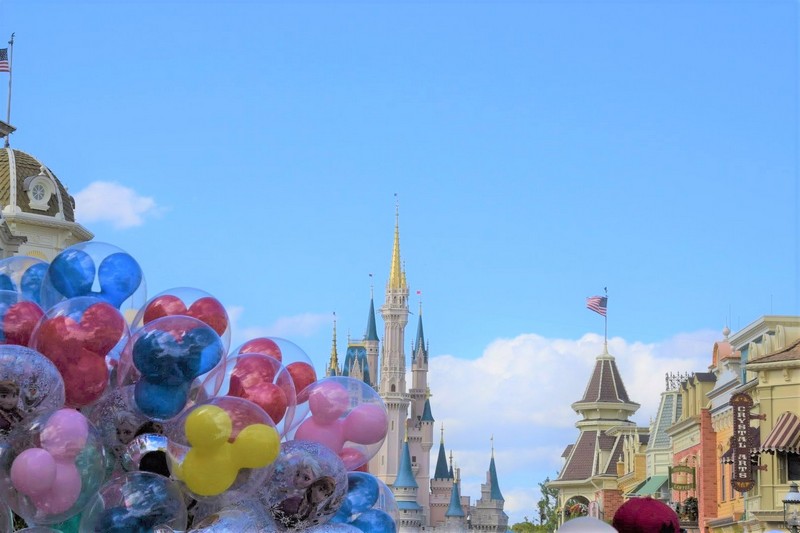 Disney castle obscured slightly by baloons