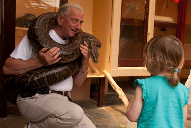 Man holding snake at Reptile Rescue Centre in Crete